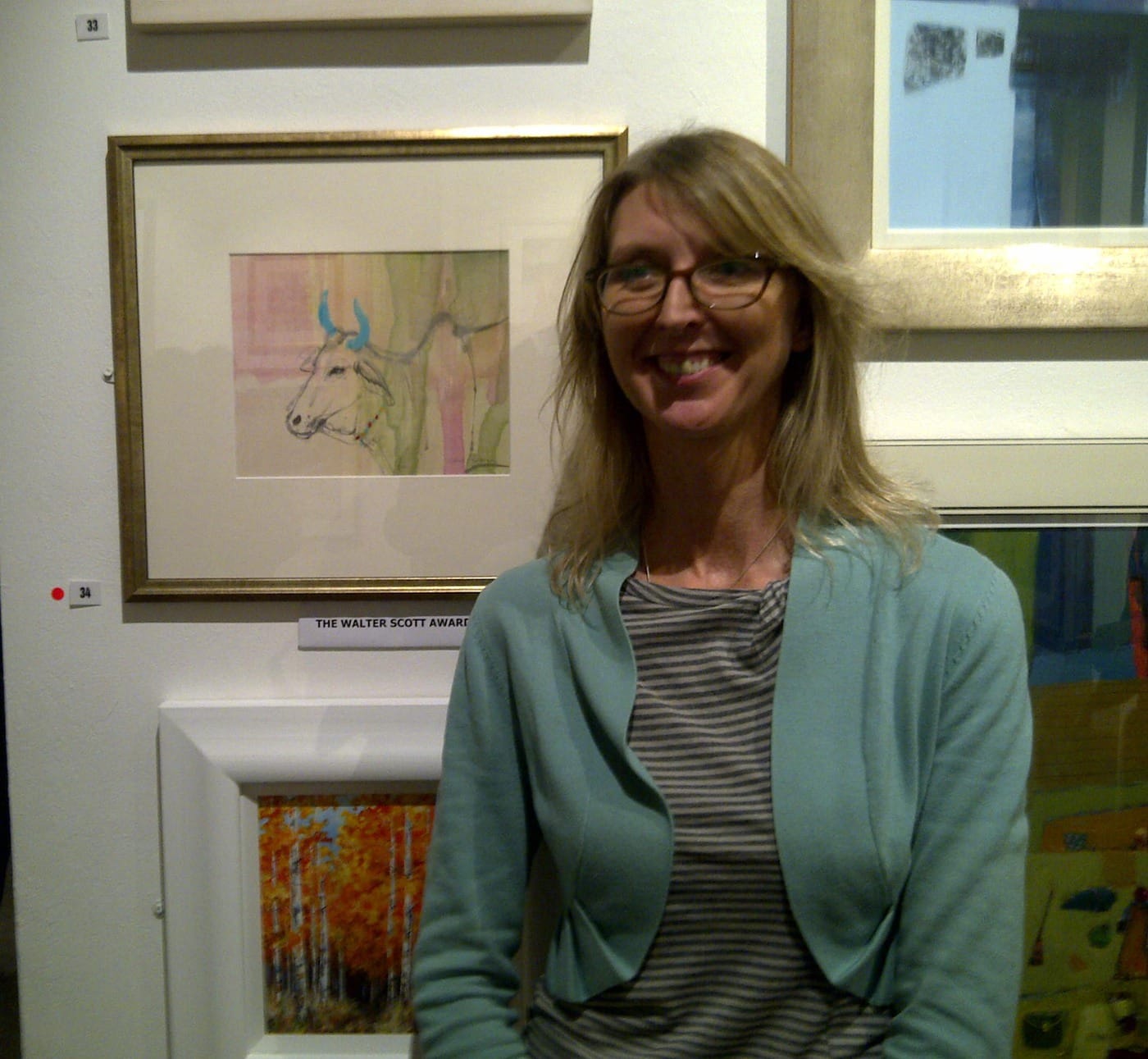 Claire Harkess with award winning painting Sacred Cow, India